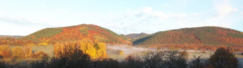 Vue panoramique depuis Le Clos du Haslach sur la vallée de la Bruche et les Vosges alsaciennes enneigées