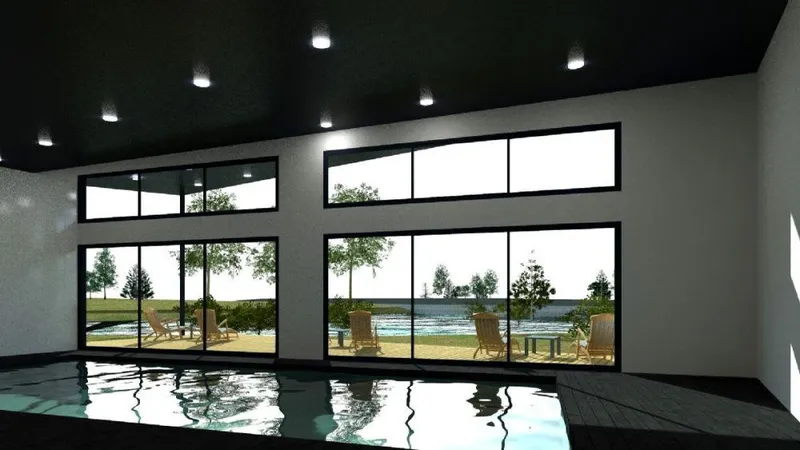 Bassin intérieur bordé de larges baies vitrées donnant sur une terrasse avec transats en bois